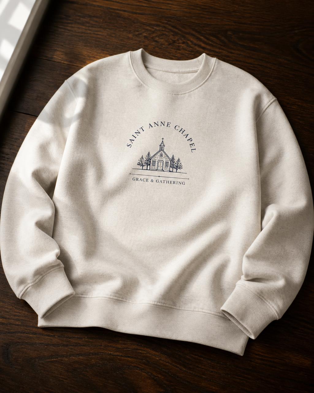 Oatmeal crewneck with a fine-line Saint Anne Chapel illustration